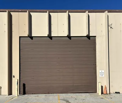 Commercial door technicians reviewing a Cincinnati service plan