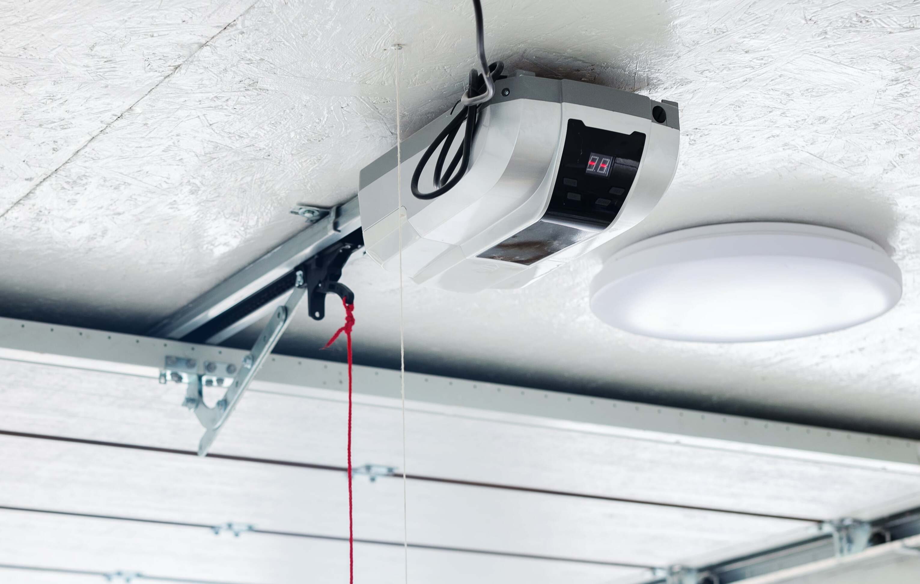Belt-drive garage door opener repair with technician servicing quiet drive rail in Cincinnati