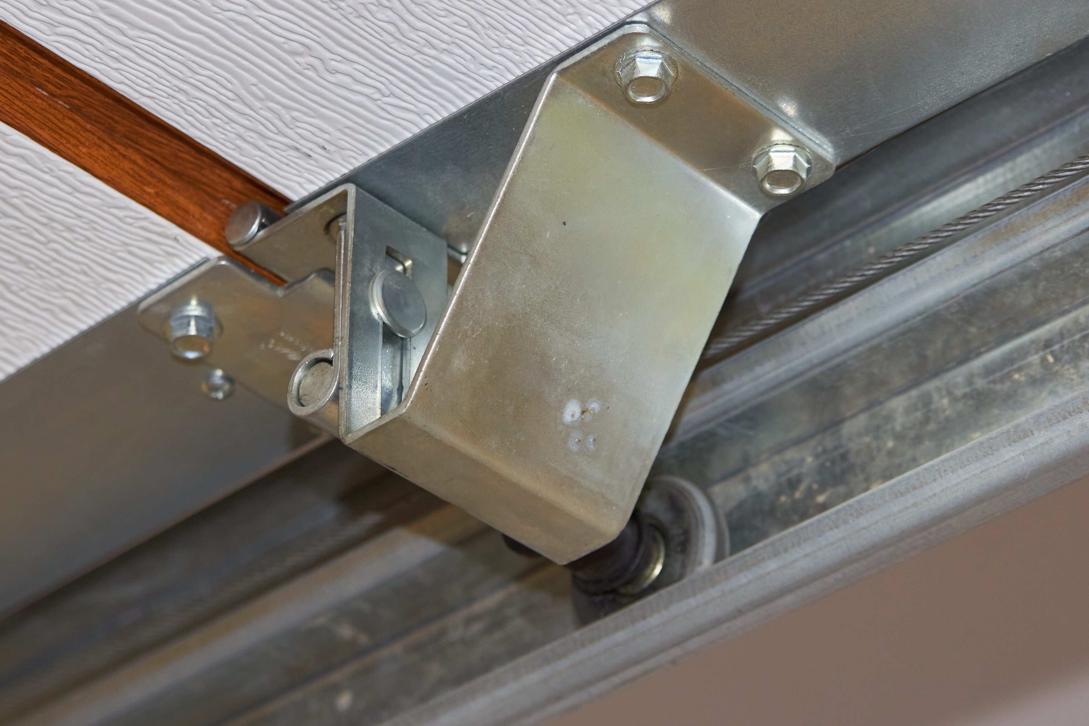 New garage door rollers and hinges installed for quieter operation