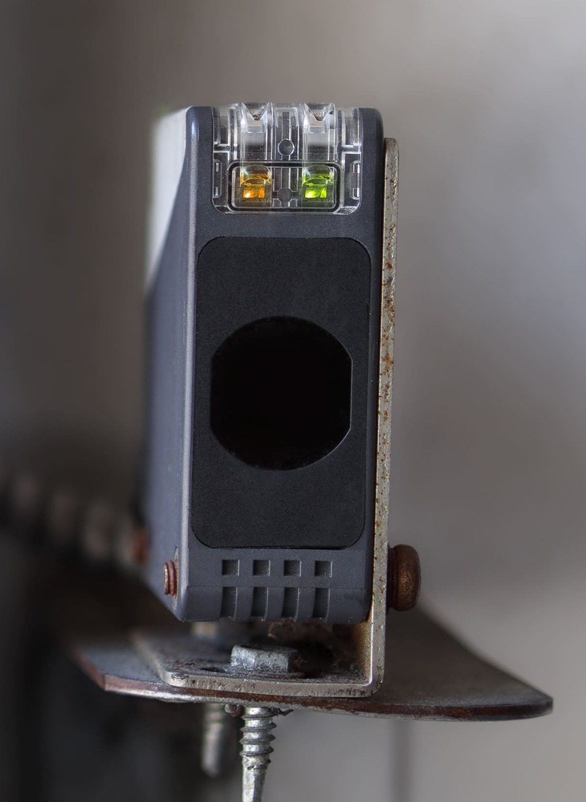 Garage door safety sensors being aligned and tested